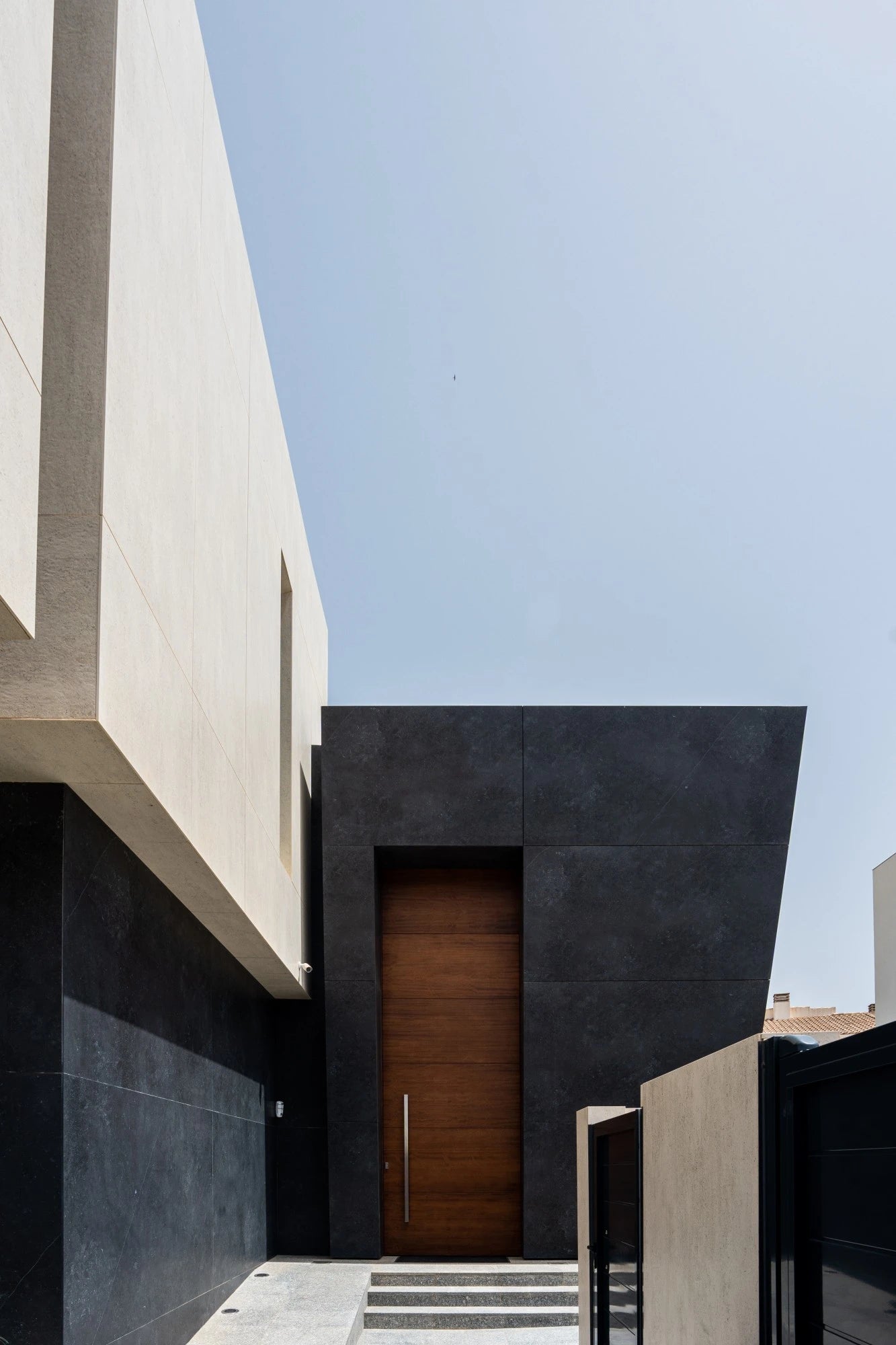 Dekton Fossil exterior cladding with dark charcoal finish and clean lines — premium dekton kitchen countertops by Signature Stone Las Vegas