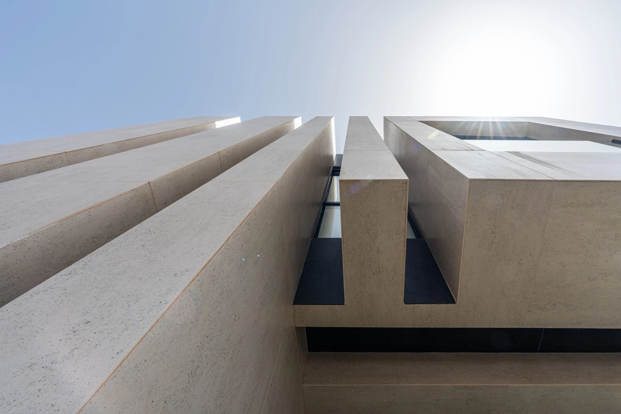 Dekton Fossil concrete architectural facade with geometric linear patterns and modern finish — premium dekton countertops installed by Signature Stone Las Vegas