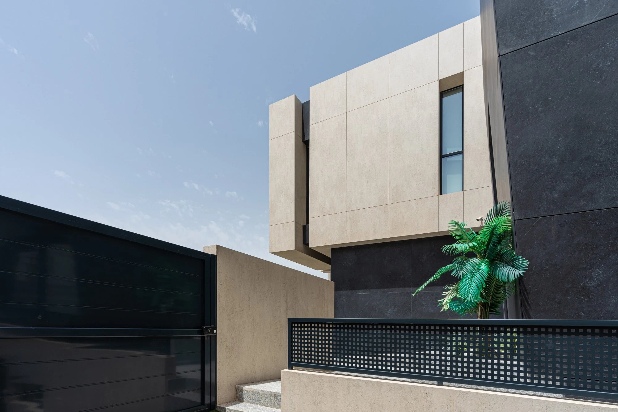 Dekton Fossil exterior cladding with smooth beige finish and geometric panels — premium dekton kitchen countertops by Signature Stone Las Vegas