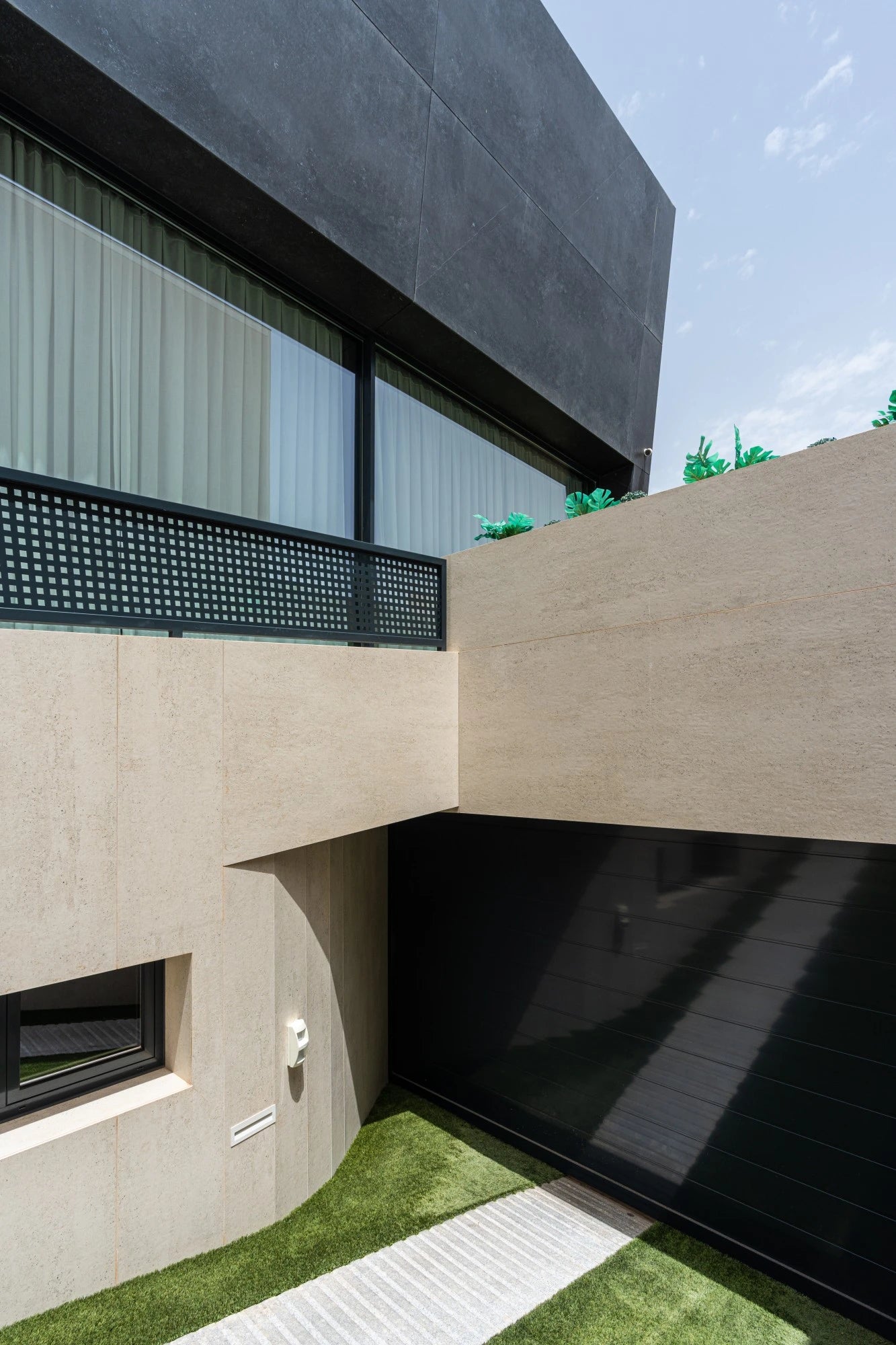 Dekton Fossil exterior cladding with light beige tone and matte finish on modern building facade — dekton kitchen countertops by Signature Stone Las Vegas