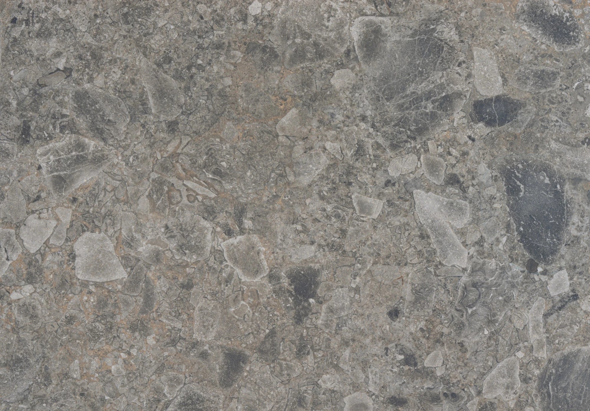 Dekton Ceppo countertop surface with gray speckled concrete-like finish and visible aggregate texture — premium dekton surfaces fabricated and installed by S...