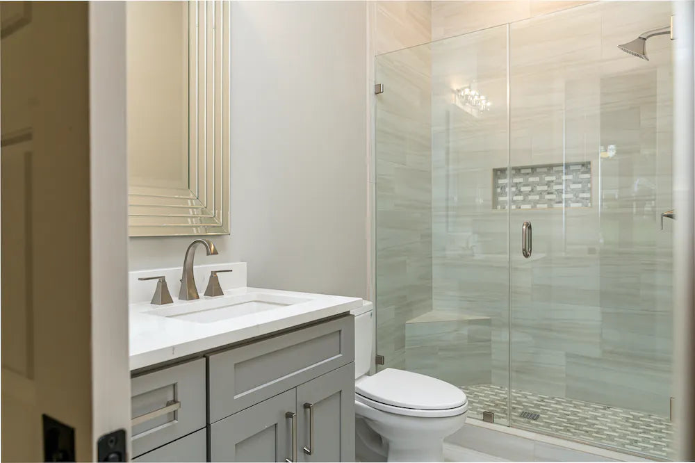 Silestone Helix bathroom vanity with white marble-look finish and polished surface — engineered quartz countertops fabricated and installed by Signature Ston...