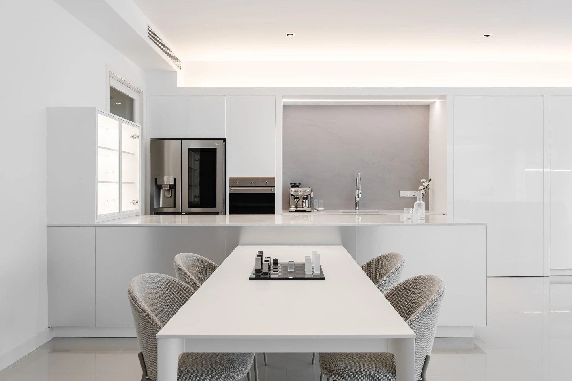 Silestone Iconic White kitchen island with clean white finish and straight edges — engineered quartz countertops fabricated and installed by Signature Stone LV