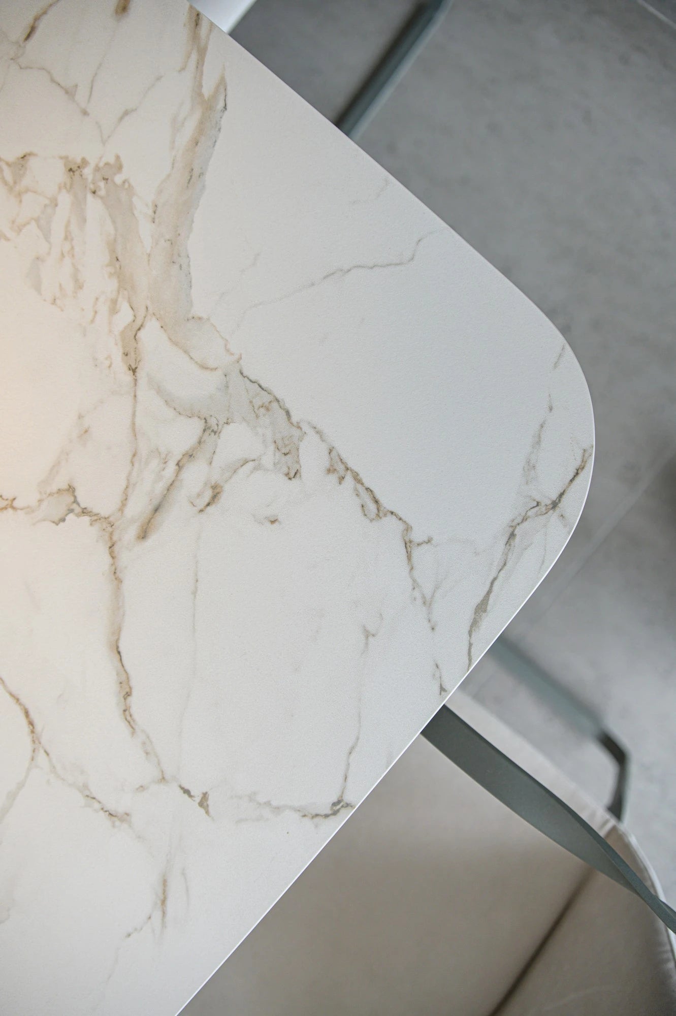 Dekton Kairos22 countertop with white marble-look veining and rounded edge — premium dekton surfaces fabricated and installed by Signature Stone LV