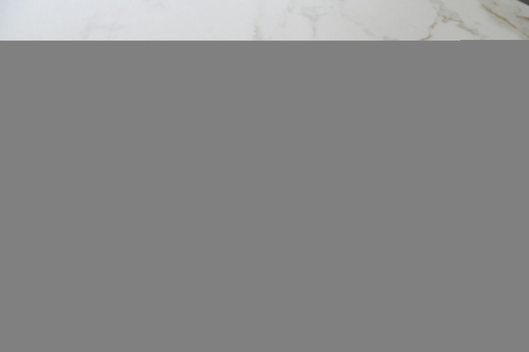 Dekton Kairos22 countertop with white marble-look veining and polished finish — premium dekton surfaces fabricated and installed by Signature Stone LV