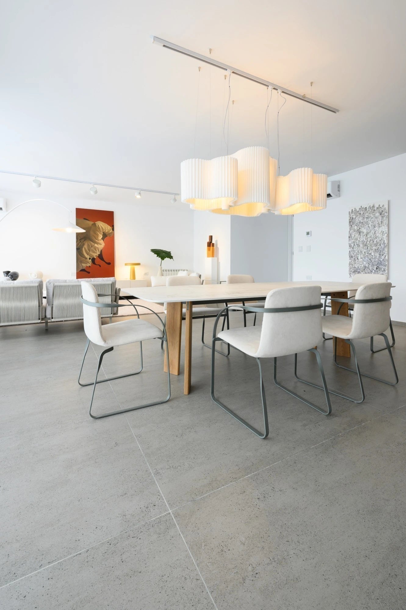 Dekton Kairos22 dining table with light gray surface and wood base — premium dekton kitchen countertops by Signature Stone Las Vegas
