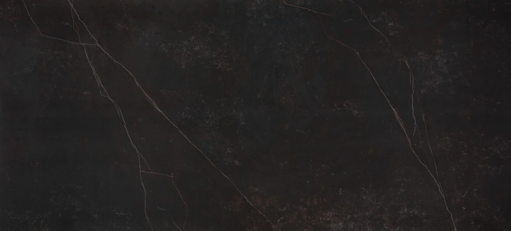 Dekton Kelya surface with dark charcoal base and subtle light veining throughout — premium dekton kitchen countertops by Signature Stone Las Vegas