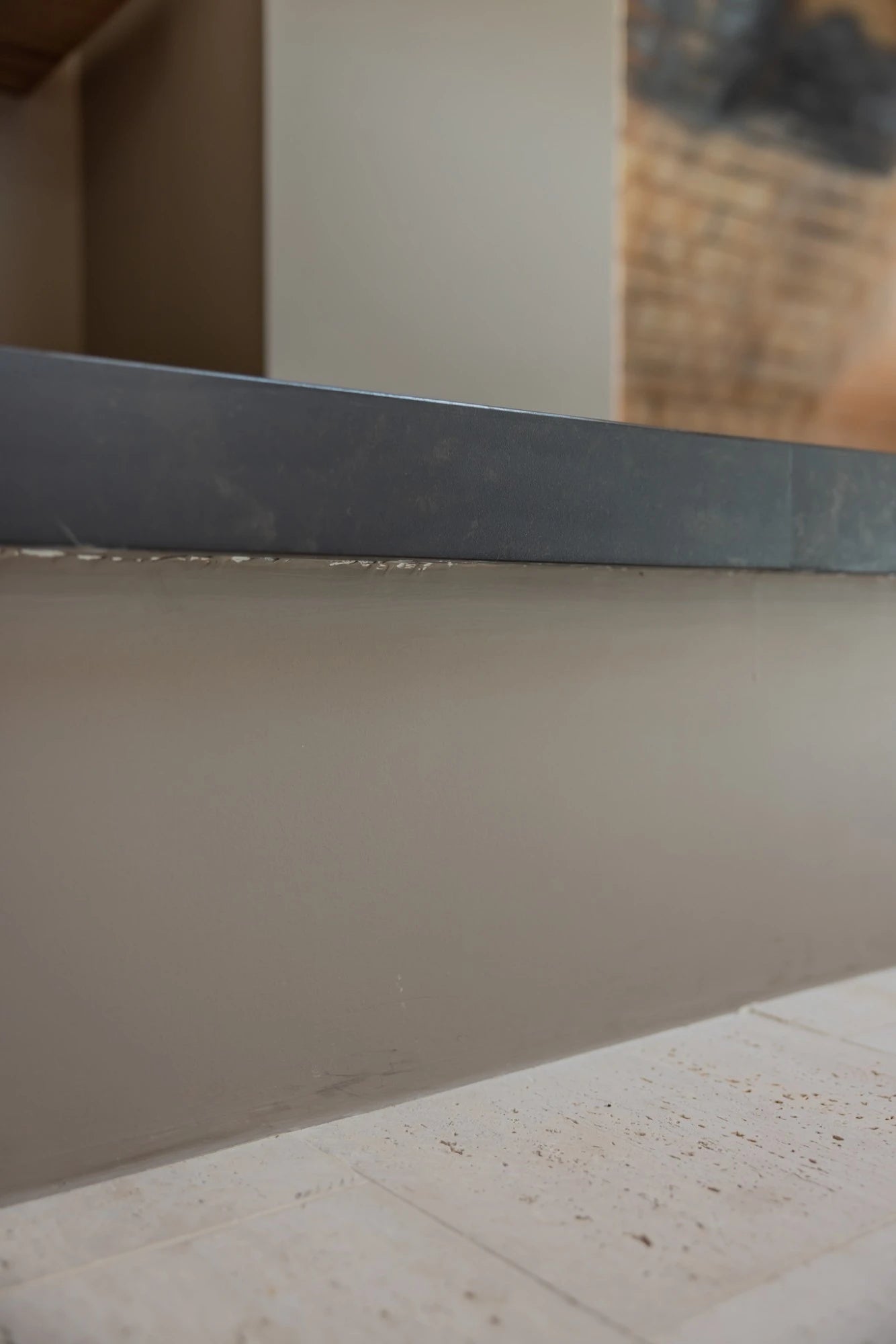 Dekton Kelya countertop with smooth gray finish and straight edge detail — premium dekton surfaces fabricated and installed by Signature Stone LV