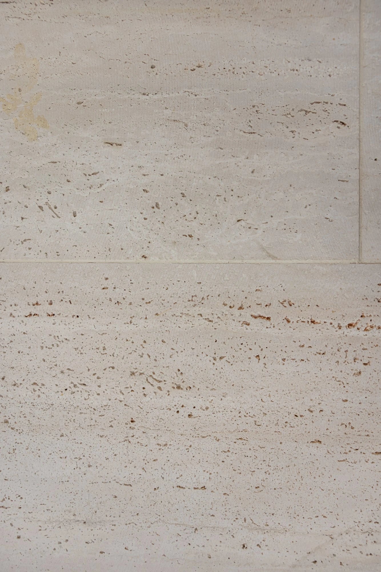 Dekton Kelya surface with cream background and brown fossil-like patterns — premium dekton countertops installed by Signature Stone Las Vegas