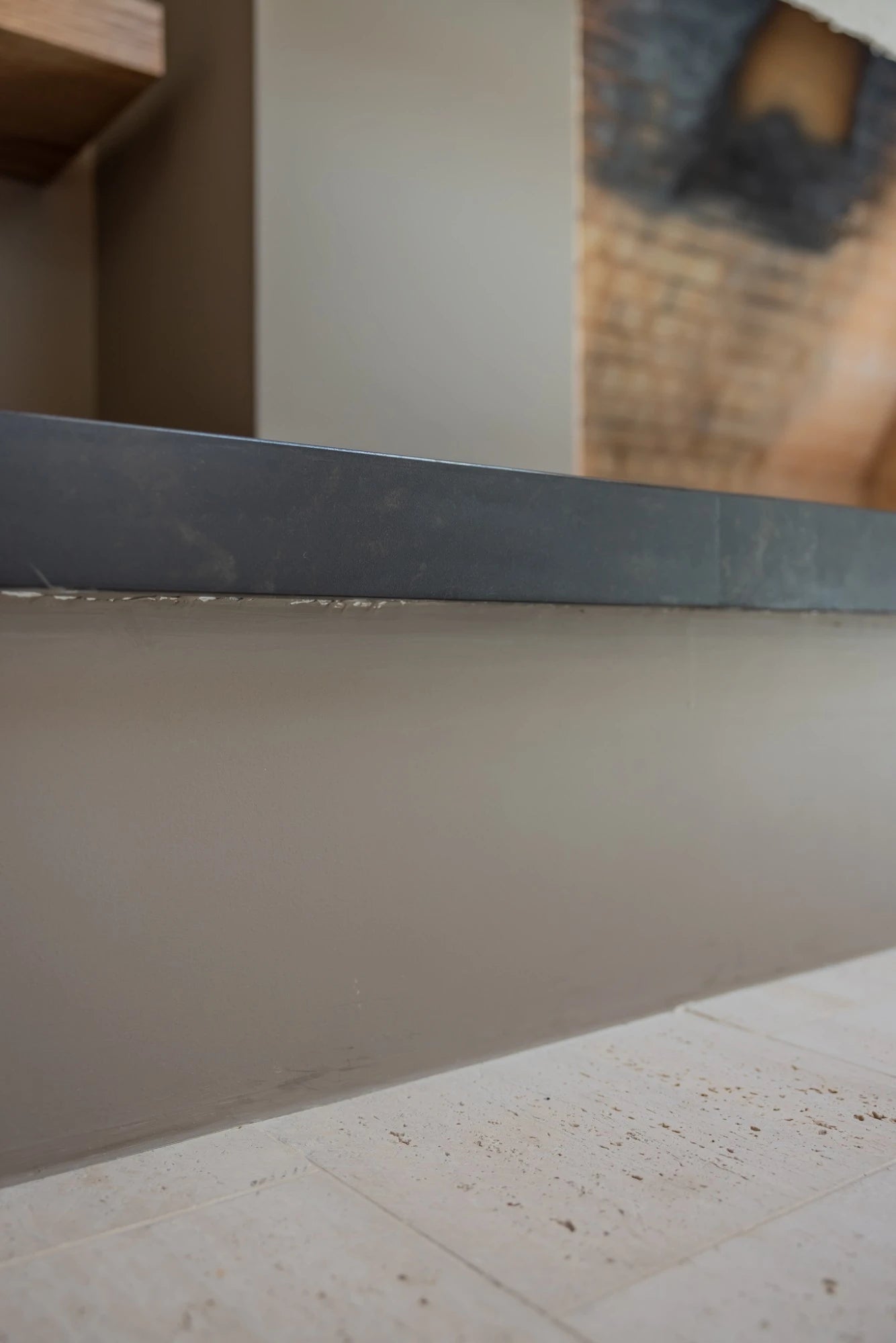 Dekton Kelya countertop with smooth gray finish and straight edge detail — premium dekton surfaces fabricated and installed by Signature Stone LV