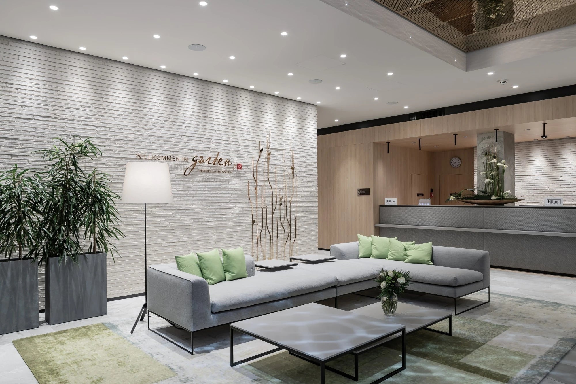 Silestone Kensho reception desk featuring white marble-look finish with gray veining — engineered quartz countertops fabricated and installed by Signature St...