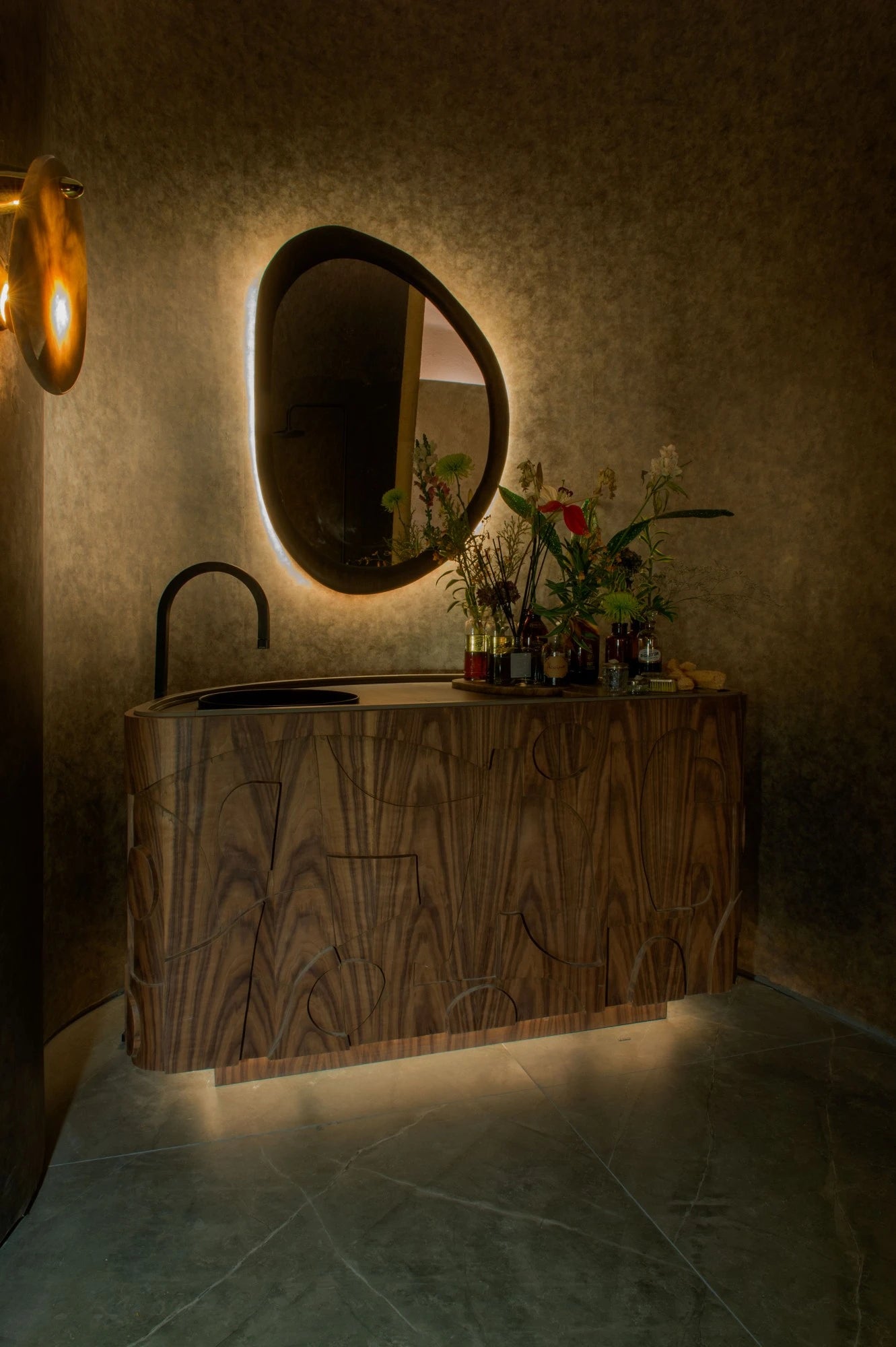 Dekton Kira vanity countertop with curved wood grain pattern and integrated sink — premium dekton surfaces fabricated and installed by Signature Stone LV