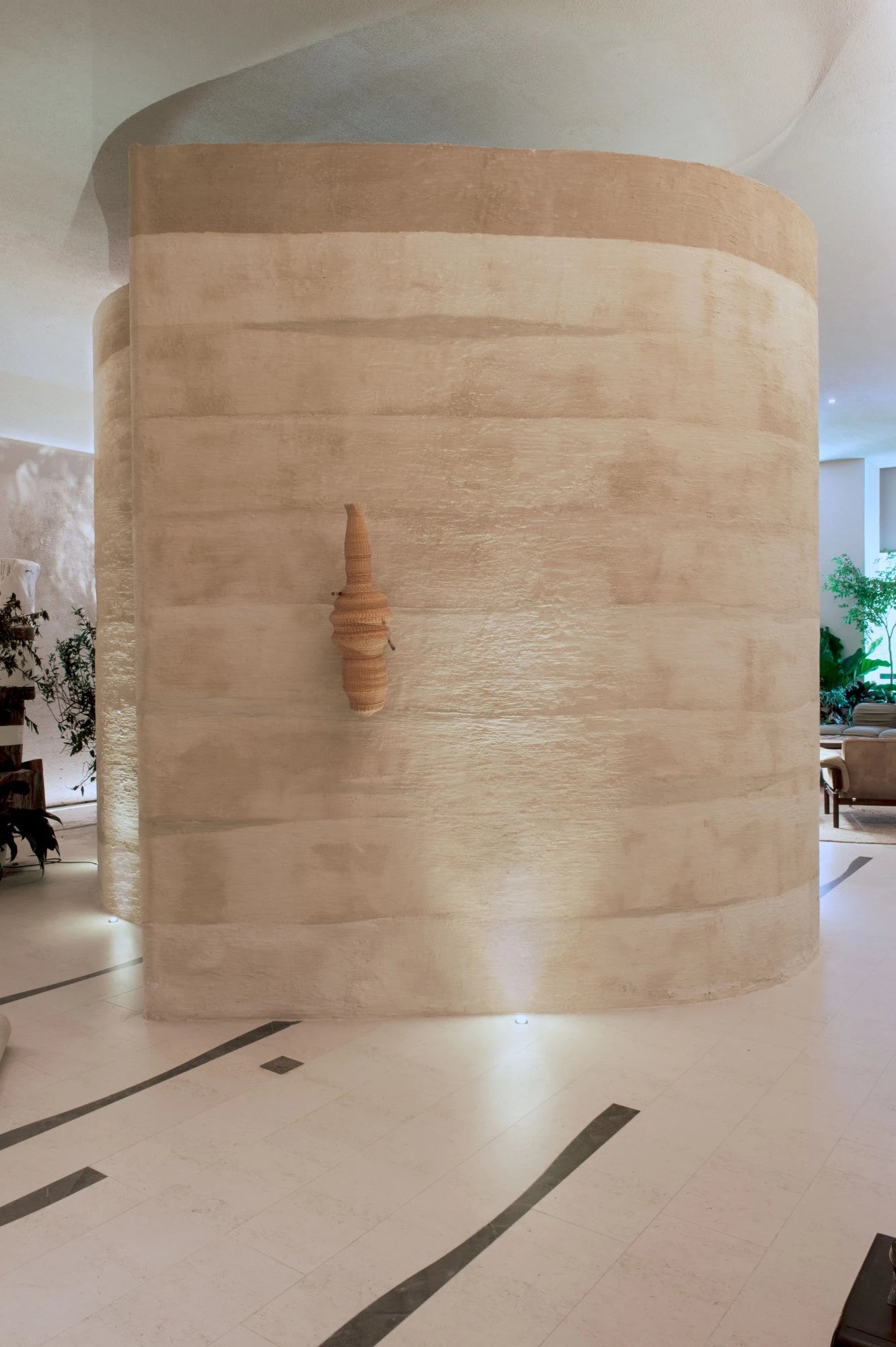 Dekton Kira curved wall feature with warm beige tones and horizontal striations — stunning dekton kitchen countertops by Signature Stone Las Vegas