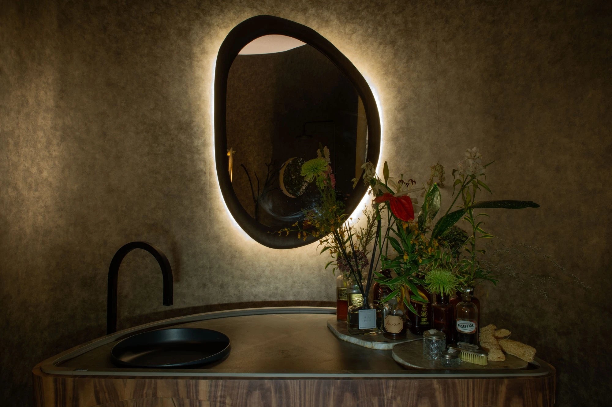 Dekton Kira countertop with curved edges and matte black sink in modern bathroom vanity — premium dekton kitchen countertops by Signature Stone Las Vegas