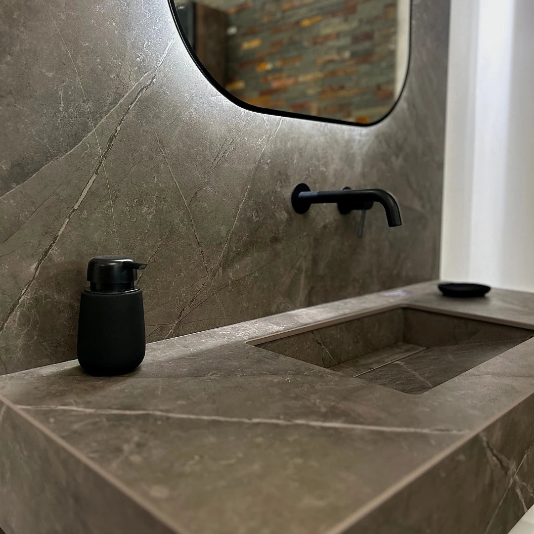 Dekton Kira bathroom vanity with integrated sink and matte gray finish — premium dekton surfaces fabricated and installed by Signature Stone LV