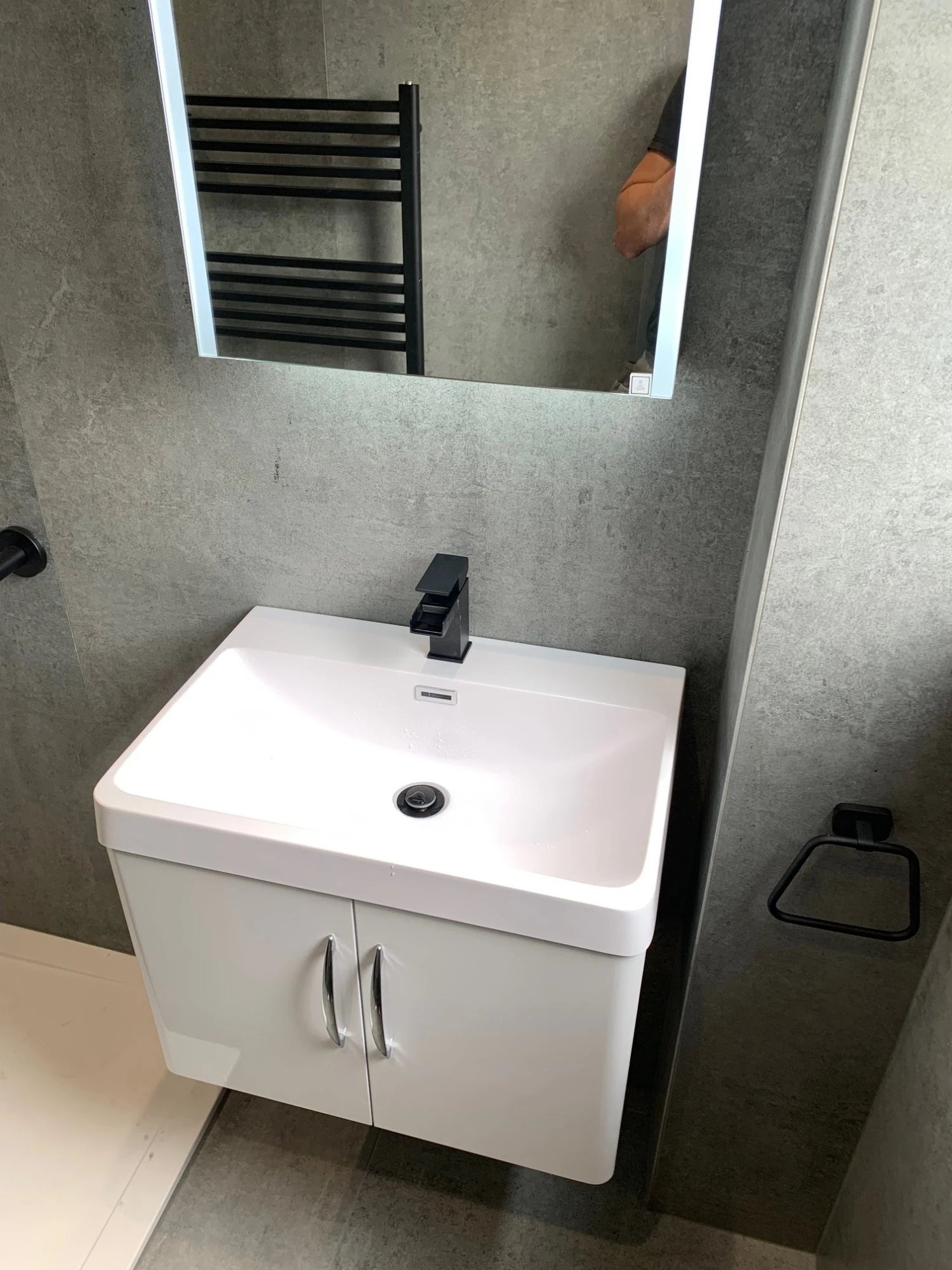 Dekton Kreta bathroom vanity with clean white finish and modern rectangular sink — premium dekton kitchen countertops by Signature Stone Las Vegas