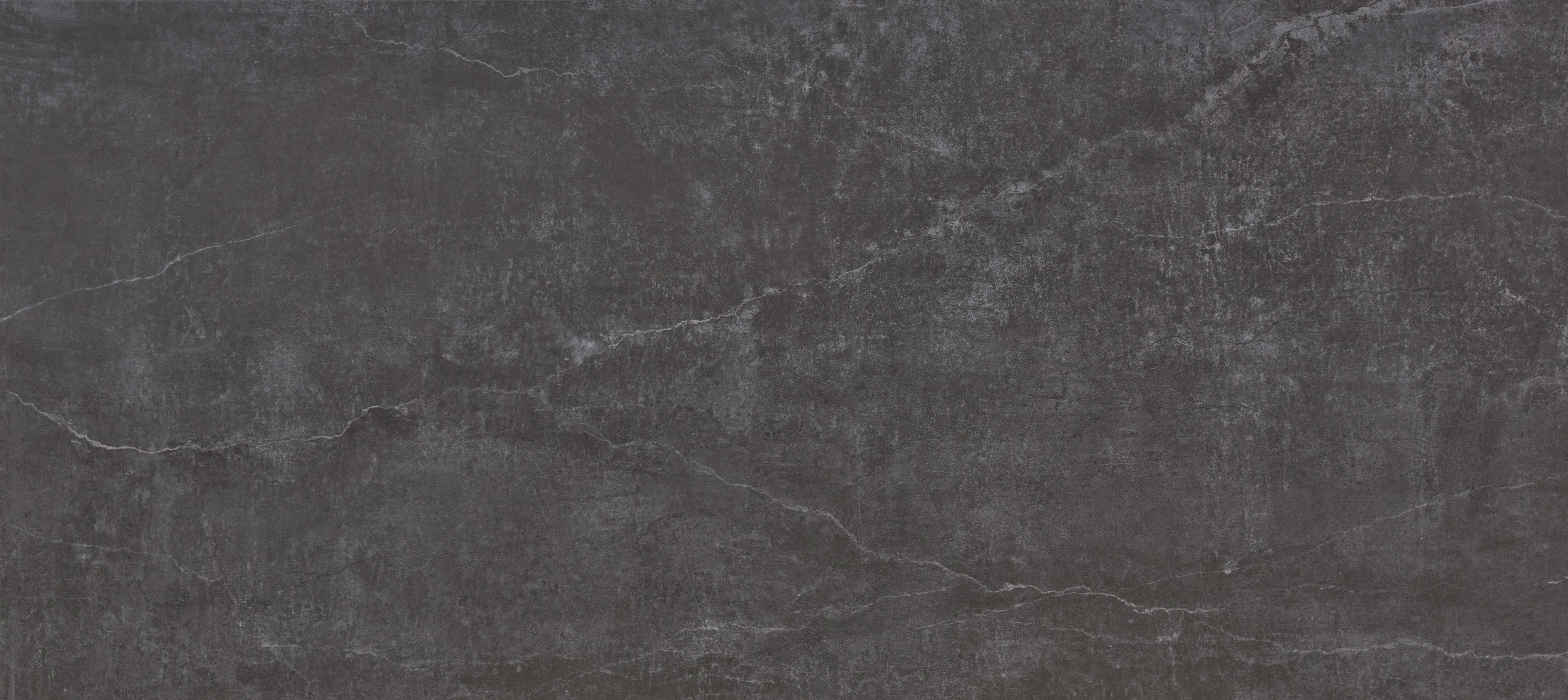 Dekton Laos slab surface with dark charcoal finish and subtle white veining — premium dekton countertops installed by Signature Stone Las Vegas
