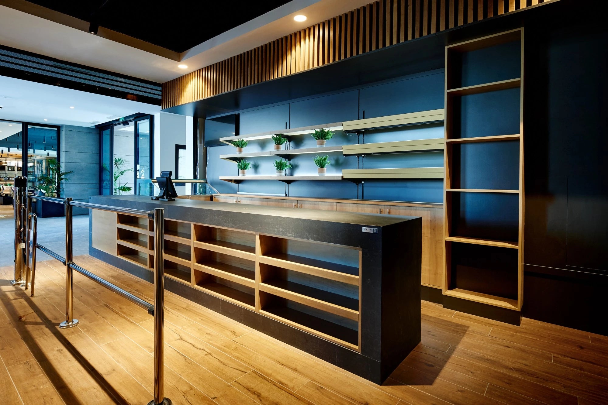 Dekton Laos countertop in modern commercial kitchen with dark finish and straight edges — premium dekton surfaces fabricated and installed by Signature Stone LV