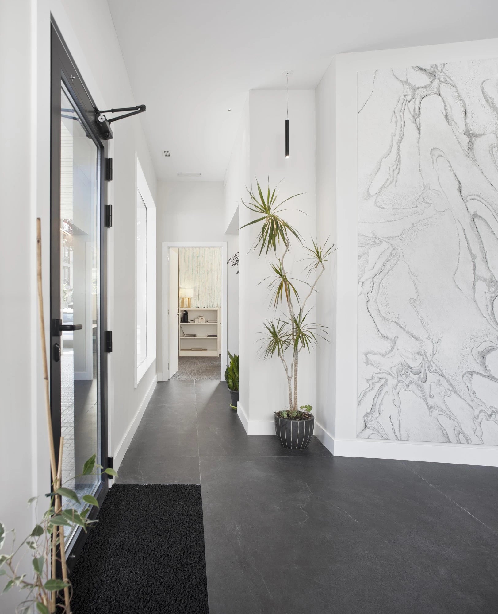 Dekton Laos wall cladding featuring white marble veining and matte finish — premium dekton surfaces fabricated and installed by Signature Stone LV