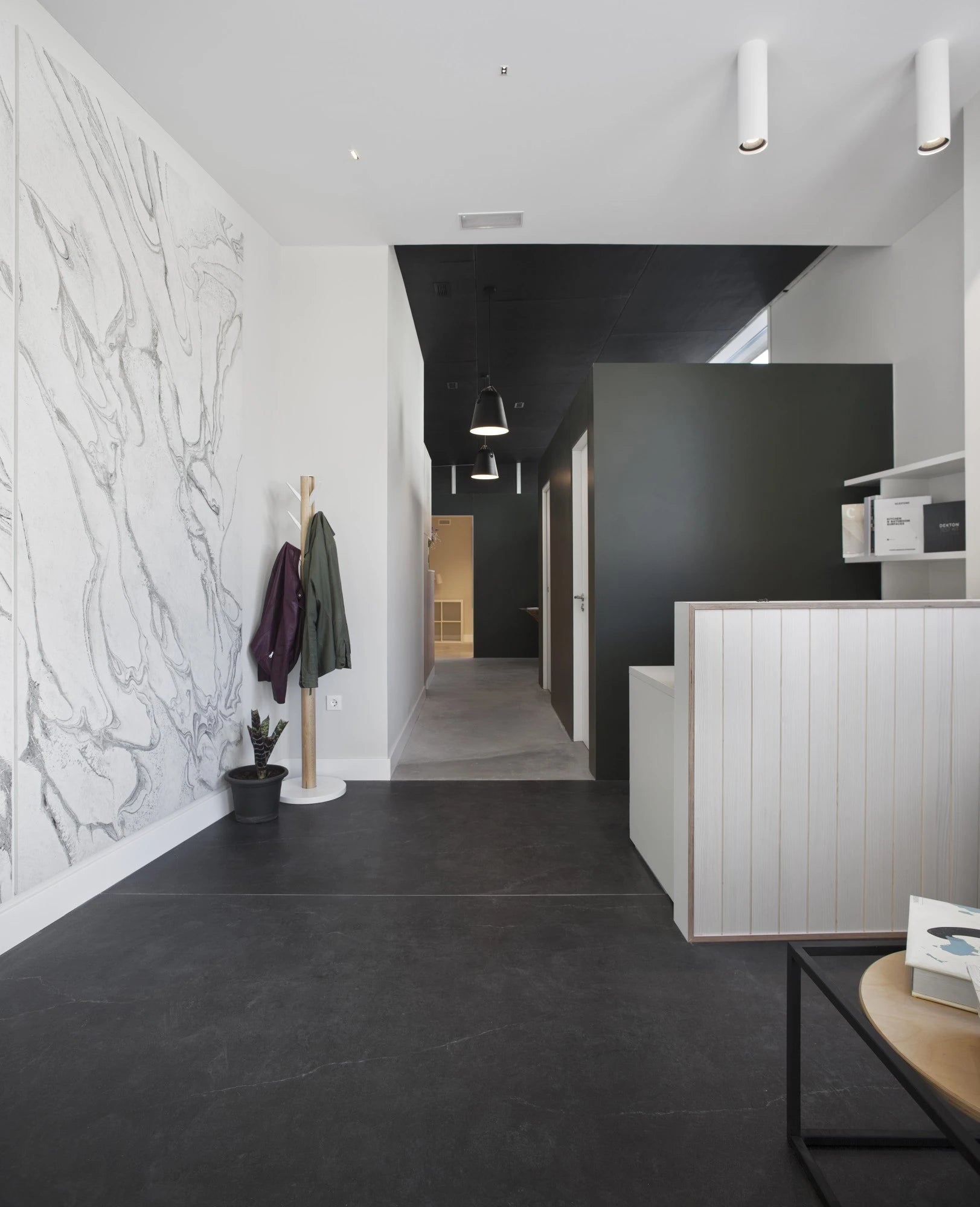 Dekton Laos kitchen island with white vertical slat design and dark flooring — premium dekton surfaces fabricated and installed by Signature Stone LV