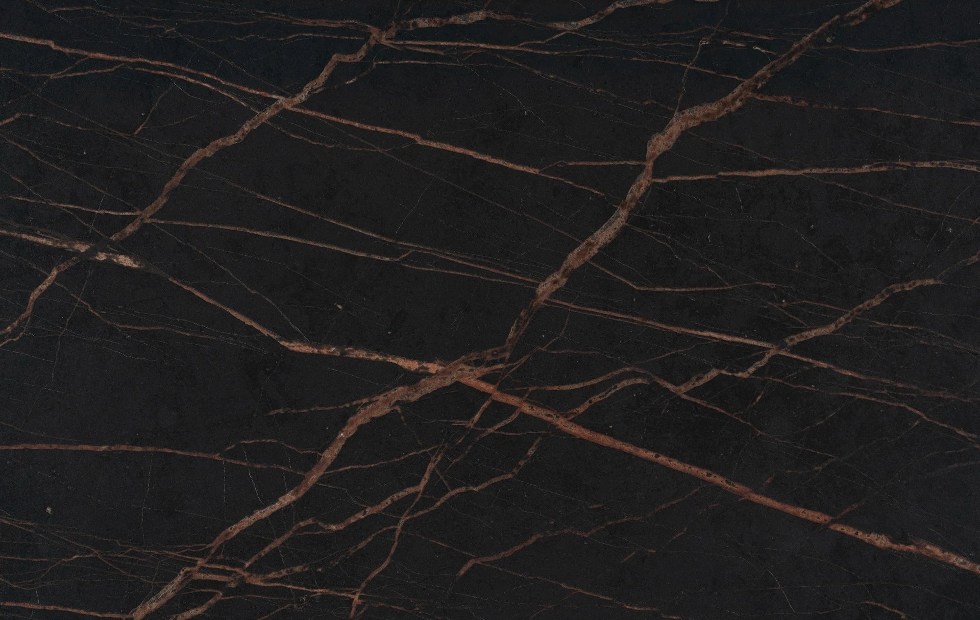 Dekton Laurent slab surface with dramatic black base and bronze veining pattern — premium dekton countertops installed by Signature Stone Las Vegas