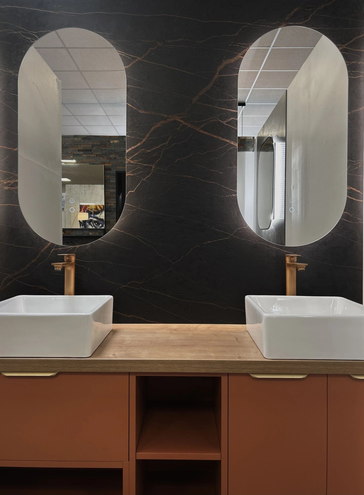 Dekton Laurent bathroom vanity with dramatic black veined pattern and wood cabinetry — premium dekton surfaces fabricated and installed by Signature Stone LV