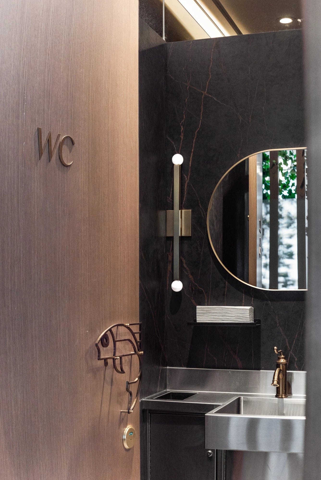 Dekton Laurent bathroom vanity with dark veined finish and integrated sink — premium dekton surfaces fabricated and installed by Signature Stone LV