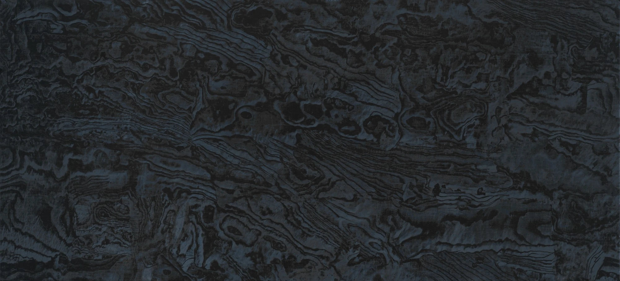 Dekton Liquid Embers countertop surface with dark swirled patterns and flowing grain texture — premium dekton surfaces fabricated and installed by Signature ...