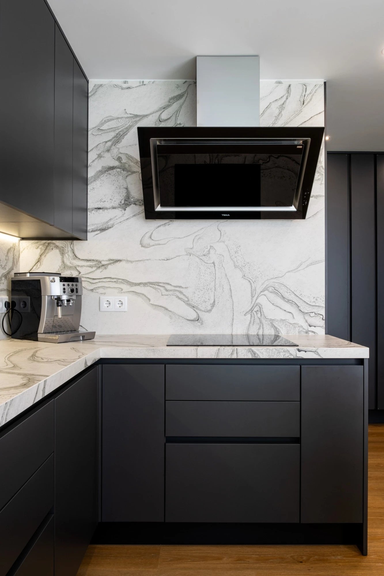 Dekton Liquid Sky kitchen surfaces with white marble-look veining and dark cabinets — premium dekton kitchen countertops by Signature Stone Las Vegas