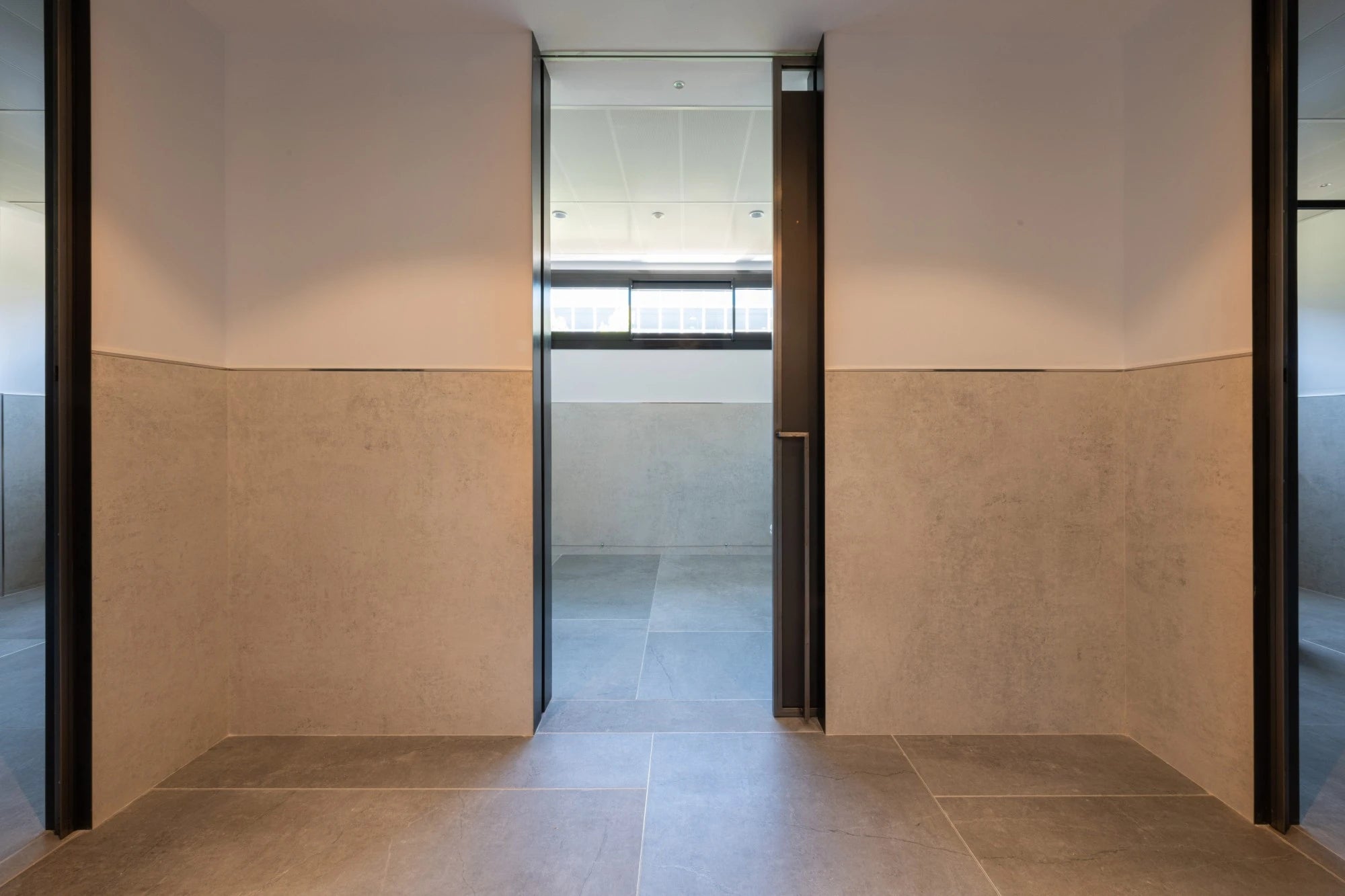 Dekton Lunar wall cladding with warm beige tones and smooth matte finish in modern interior — dekton countertops installed by Signature Stone Las Vegas