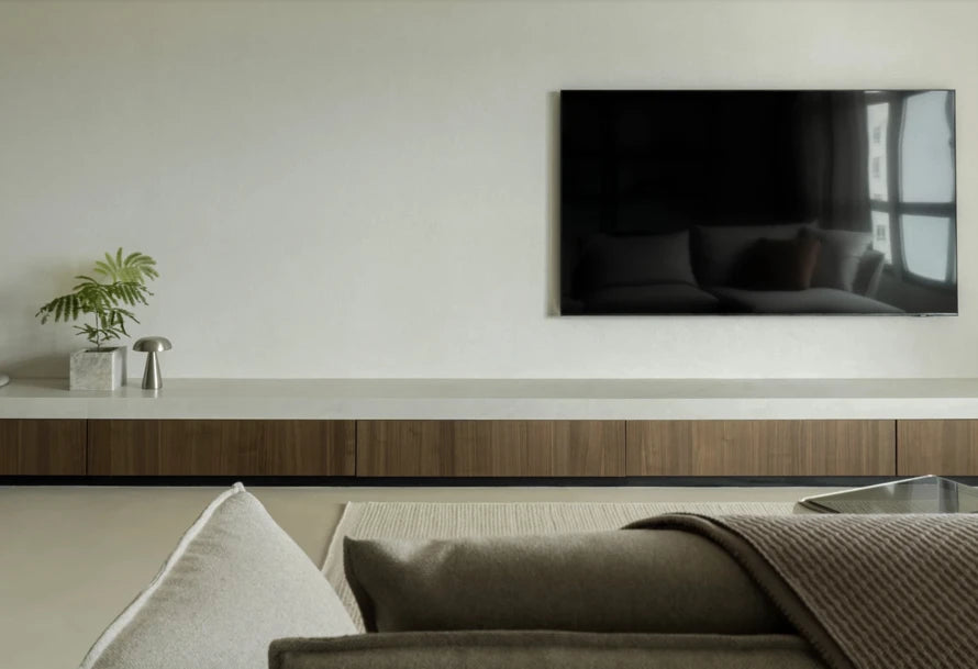Dekton Marmorio floating media console with white surface and wood grain base — modern dekton kitchen countertops by Signature Stone Las Vegas
