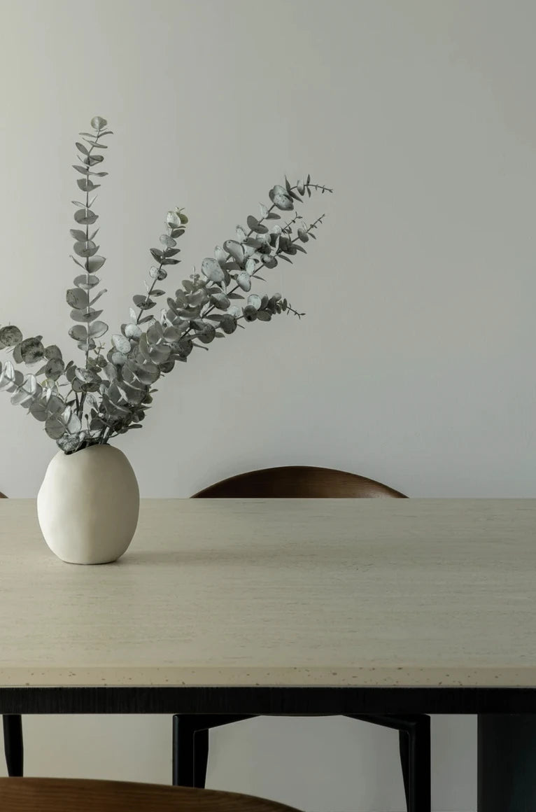 Dekton Marmorio dining table surface with light cream finish and minimalist styling — premium dekton countertops installed by Signature Stone Las Vegas