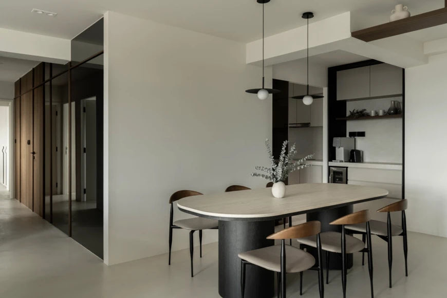 Dekton Marmorio dining table with light gray marble-look finish and sleek edges — premium dekton surfaces fabricated and installed by Signature Stone LV