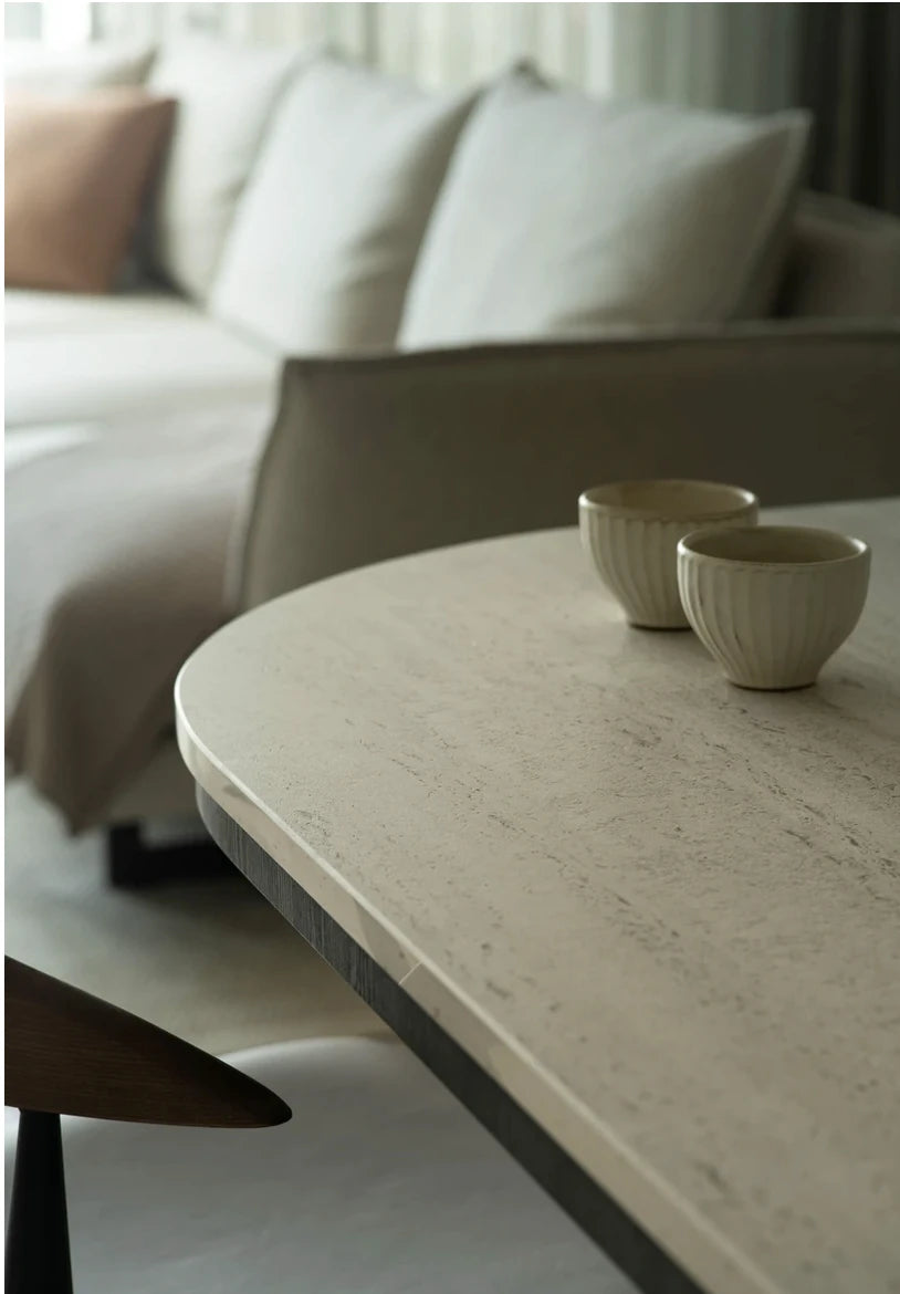 Dekton Marmorio coffee table with light marble-like veining and smooth finish — premium dekton surfaces fabricated and installed by Signature Stone LV