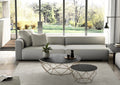 Dekton furniture coffee tables with dark matte finish and geometric wire bases in modern living room — dekton countertops installed by Signature Stone Las Vegas
