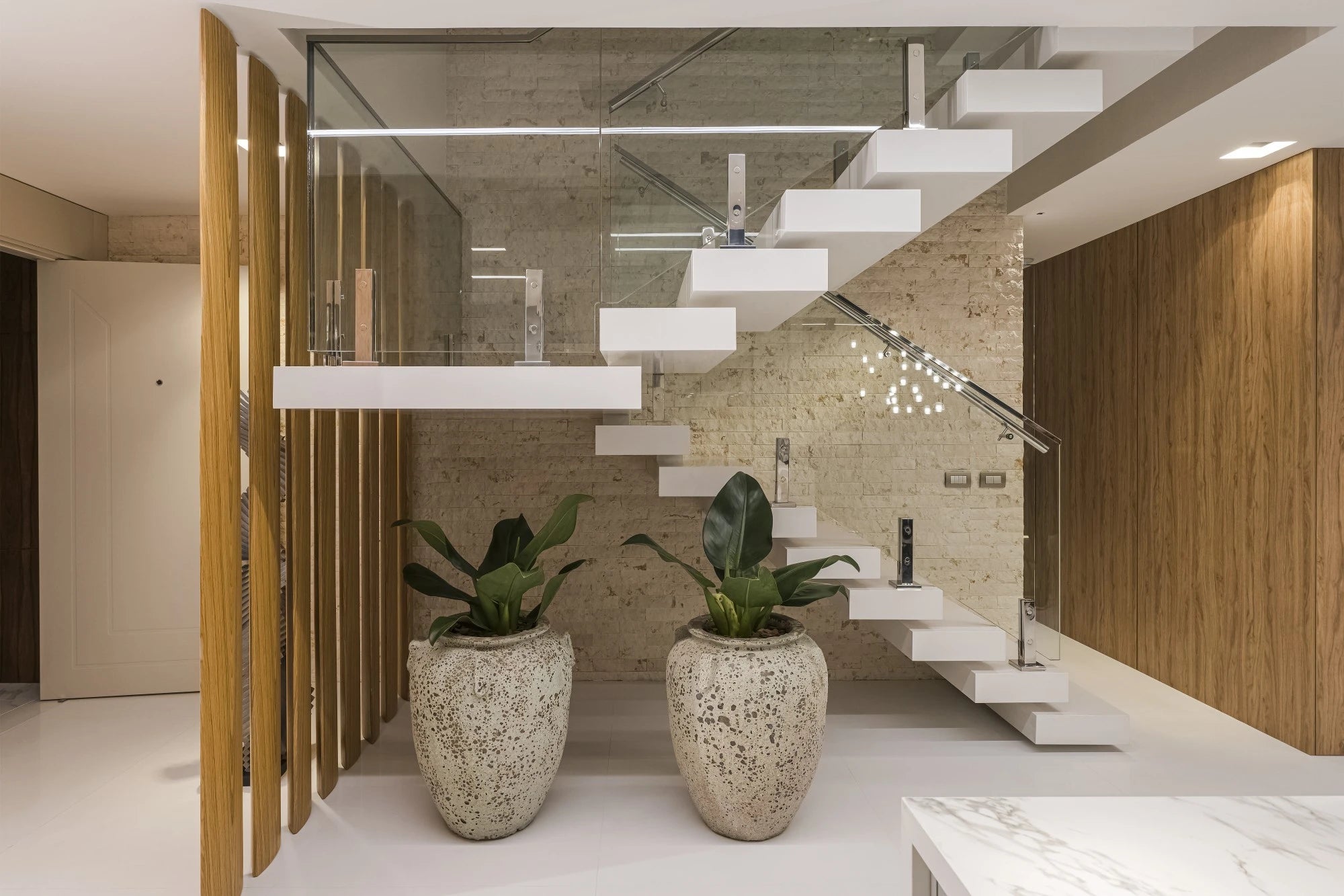 Silestone Miami White floating staircase treads with clean white finish and sleek edges — modern quartz countertops installed by Signature Stone Las Vegas