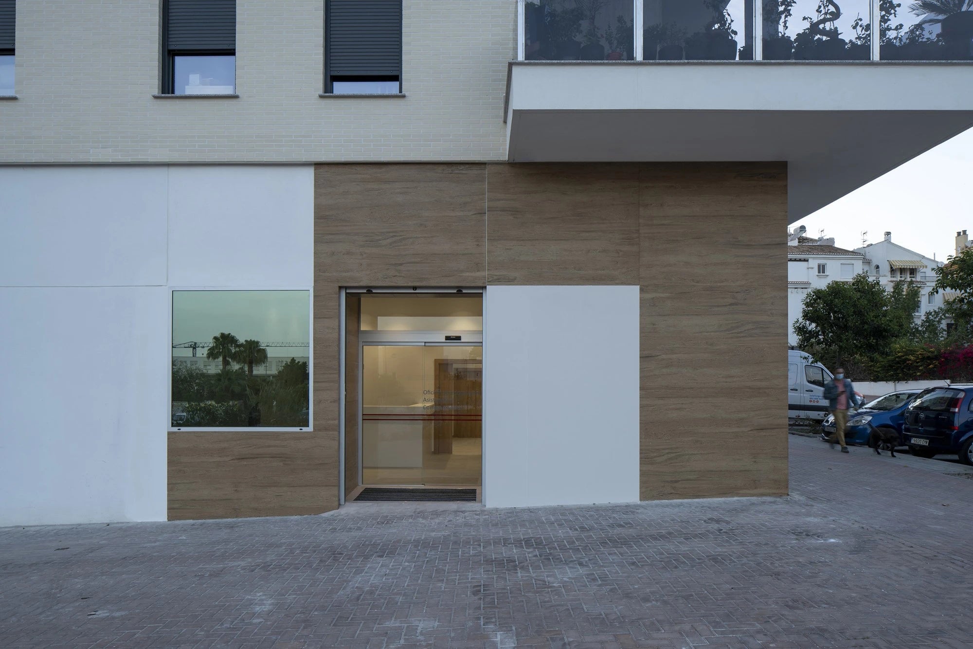 Dekton Moone exterior cladding with warm wood-grain finish and sleek modern panels — premium dekton surfaces fabricated and installed by Signature Stone LV