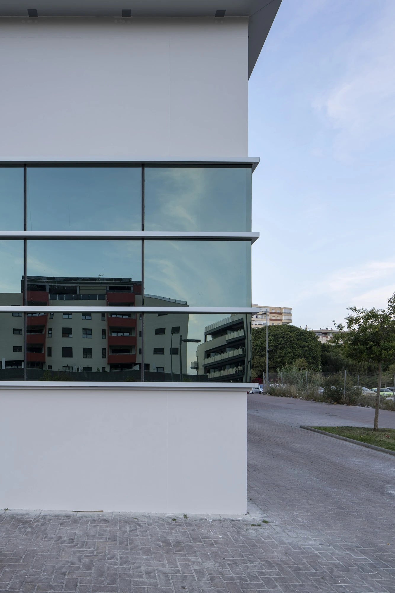 Dekton Moone modern building exterior with sleek glass panels and clean white surfaces — premium dekton countertops installed by Signature Stone Las Vegas