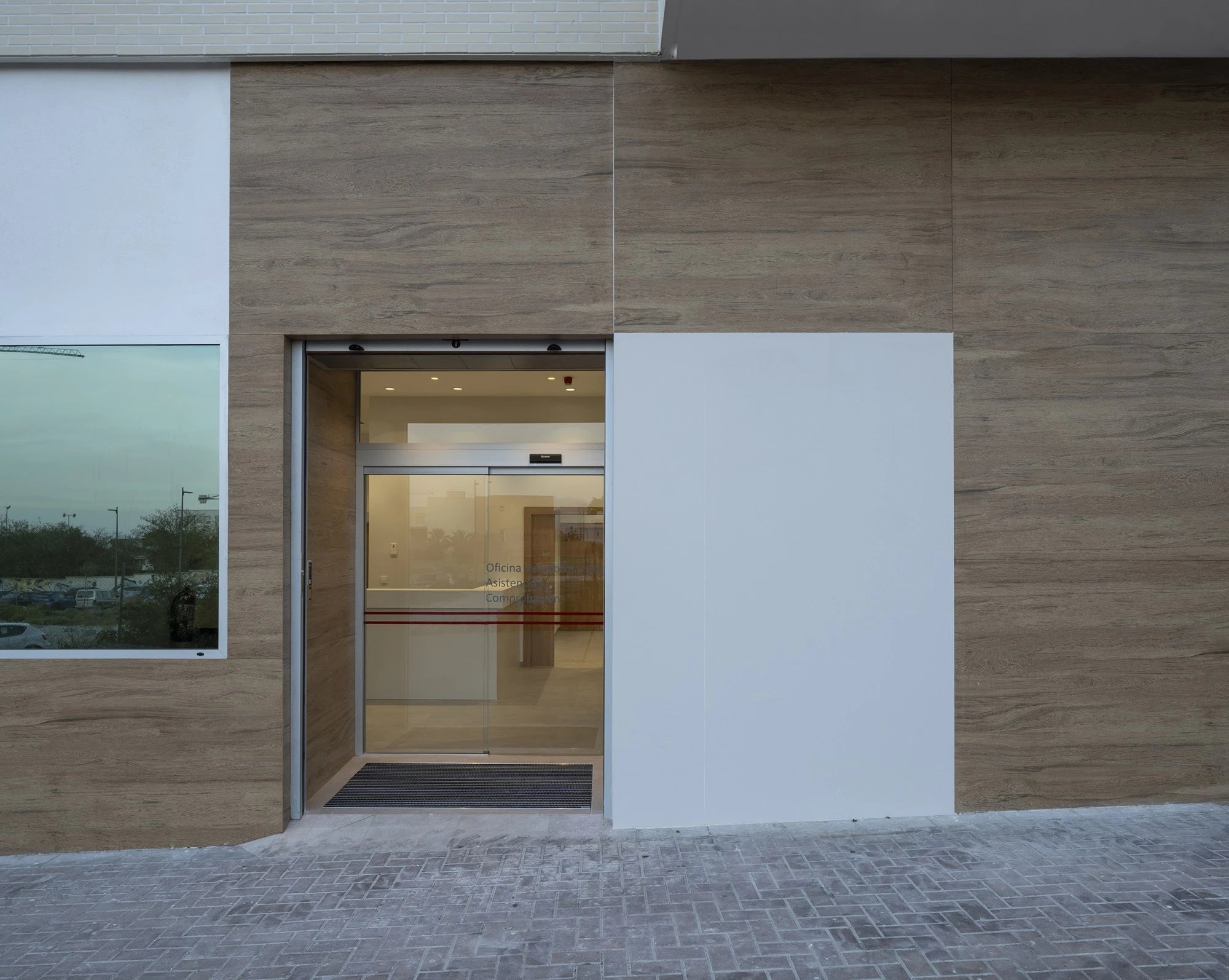 Dekton Moone building facade with wood grain texture and white panels — dekton countertops installed by Signature Stone Las Vegas