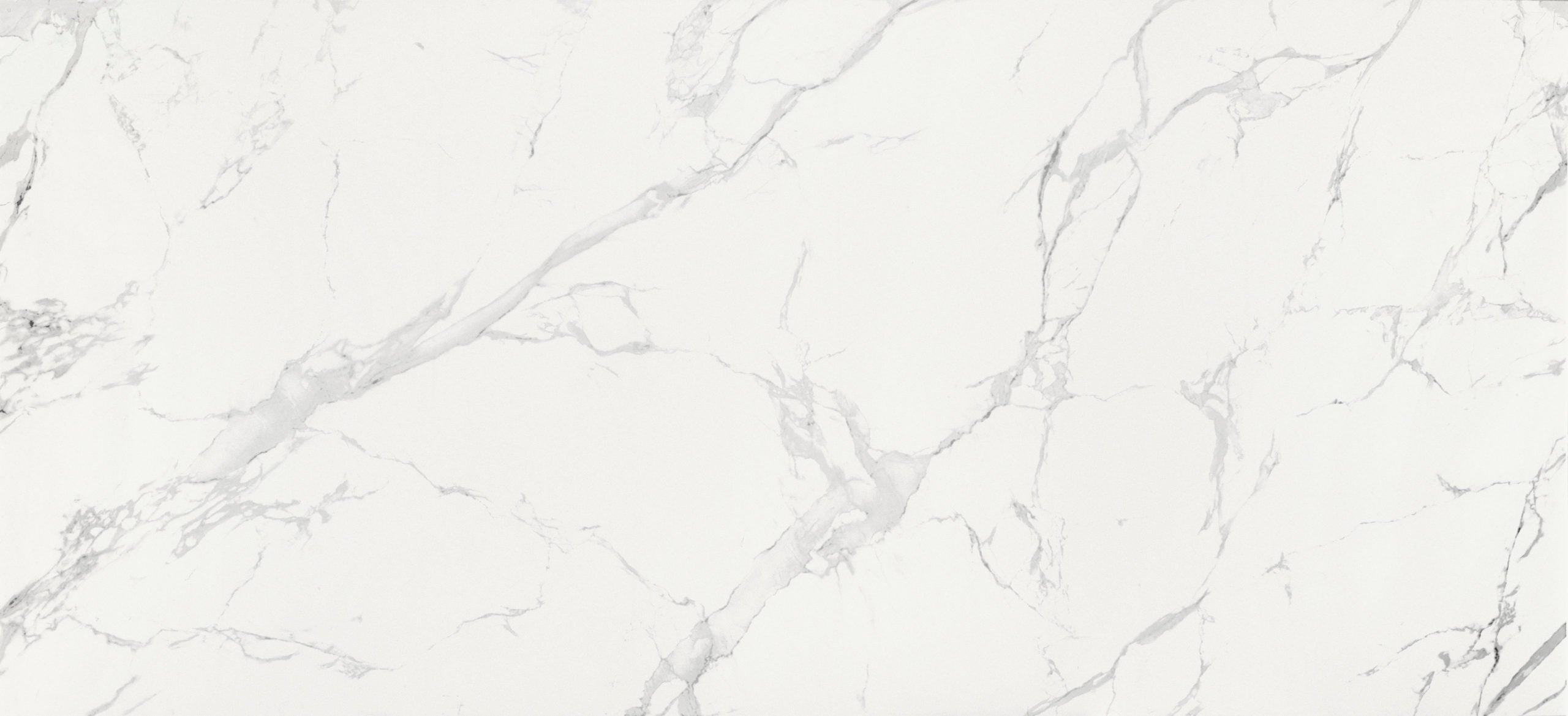 Dekton Natura countertop with white marble-look veining and polished finish — premium dekton surfaces fabricated and installed by Signature Stone LV