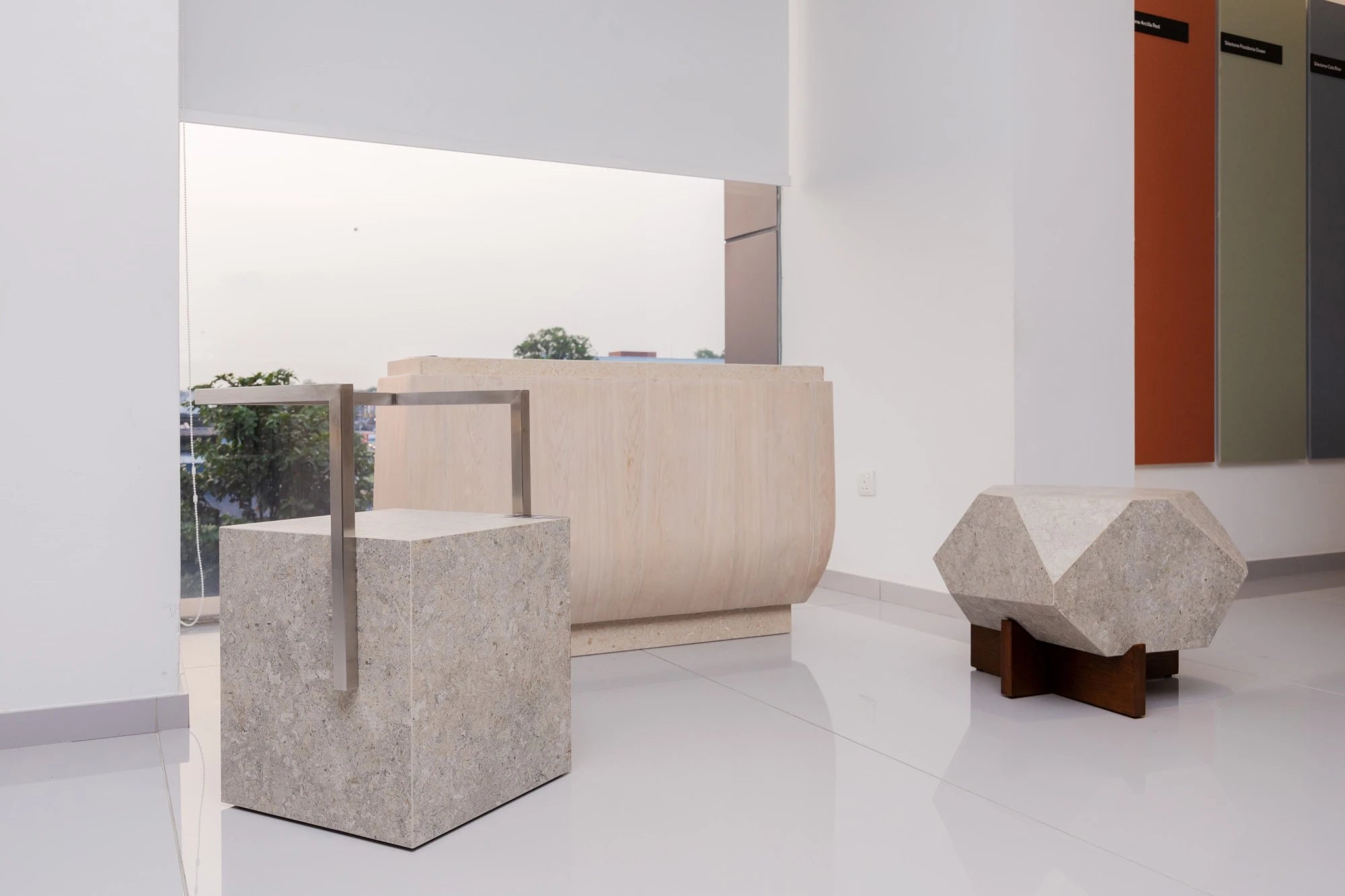Dekton Nebbia reception desk with light gray speckled finish and curved edges — premium dekton countertops installed by Signature Stone Las Vegas