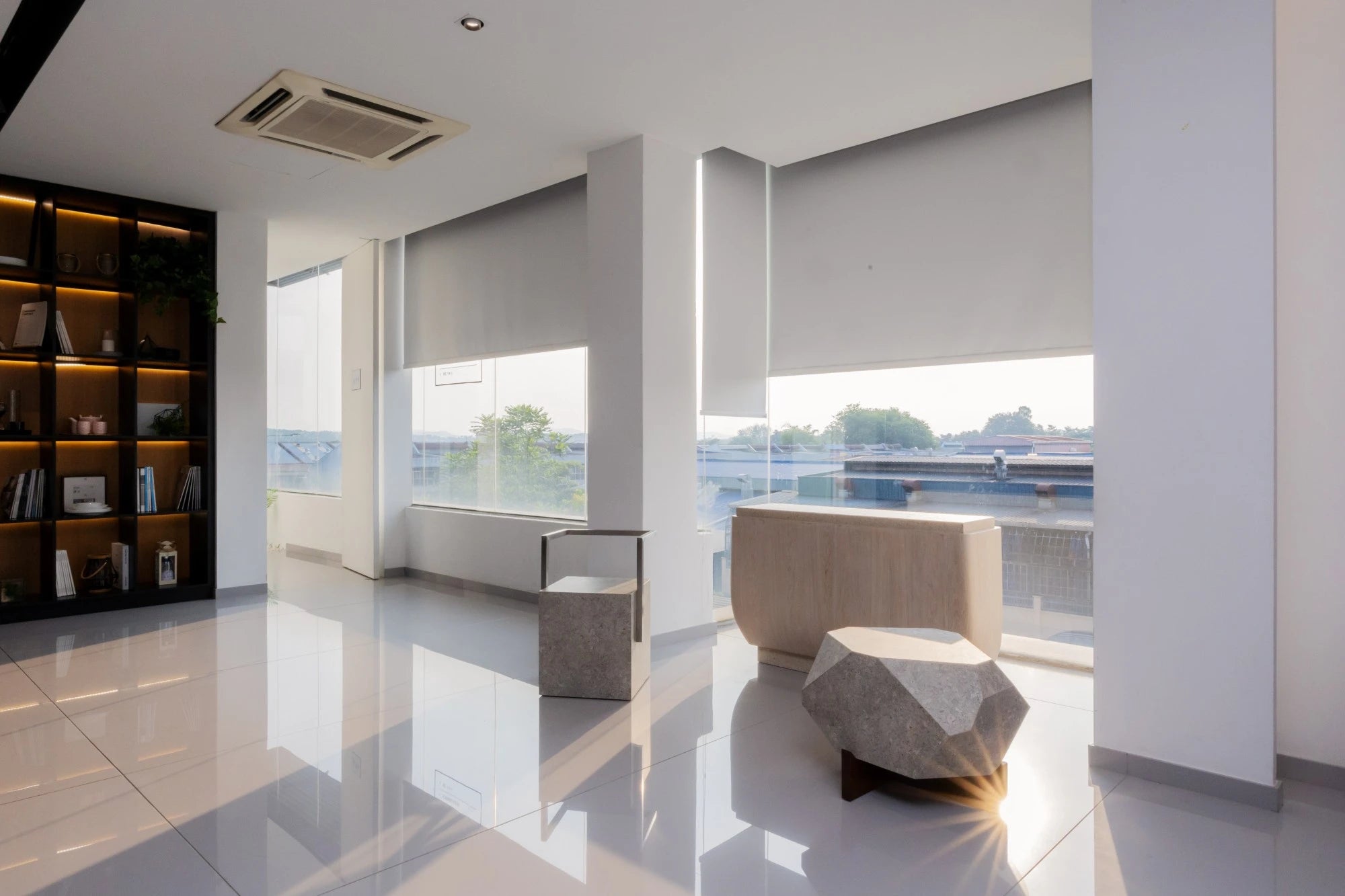 Dekton Nebbia flooring installation with polished white finish and modern geometric furniture — premium dekton surfaces fabricated and installed by Signature...