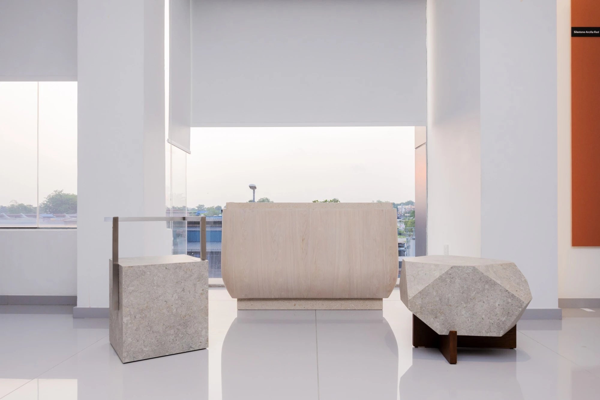 Dekton Nebbia stone displays in modern showroom with light gray marbled finish — dekton countertops installed by Signature Stone Las Vegas