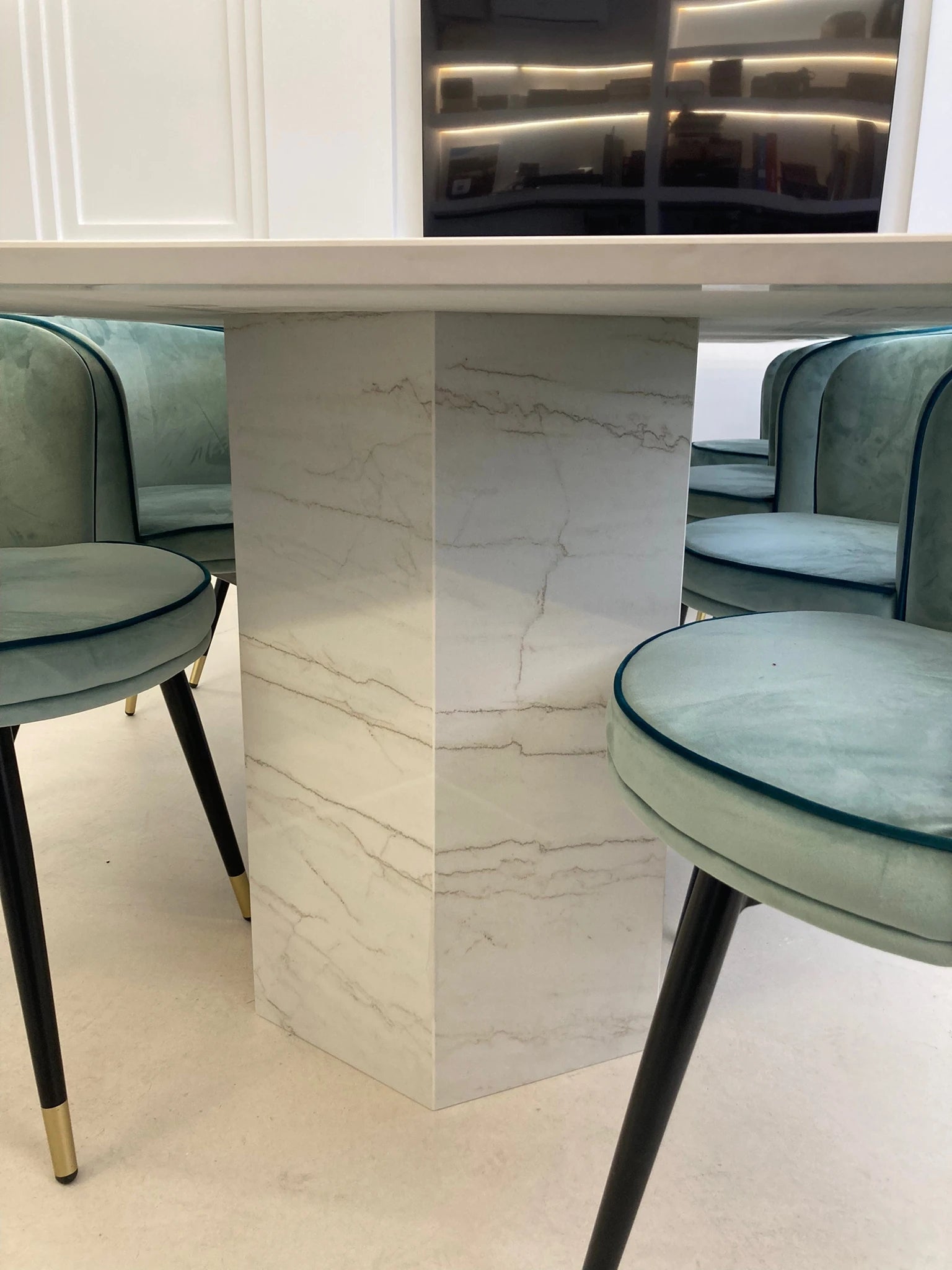 Dekton Neural countertop island with white marble-look veining and modern pedestal base — premium dekton surfaces fabricated and installed by Signature Stone LV