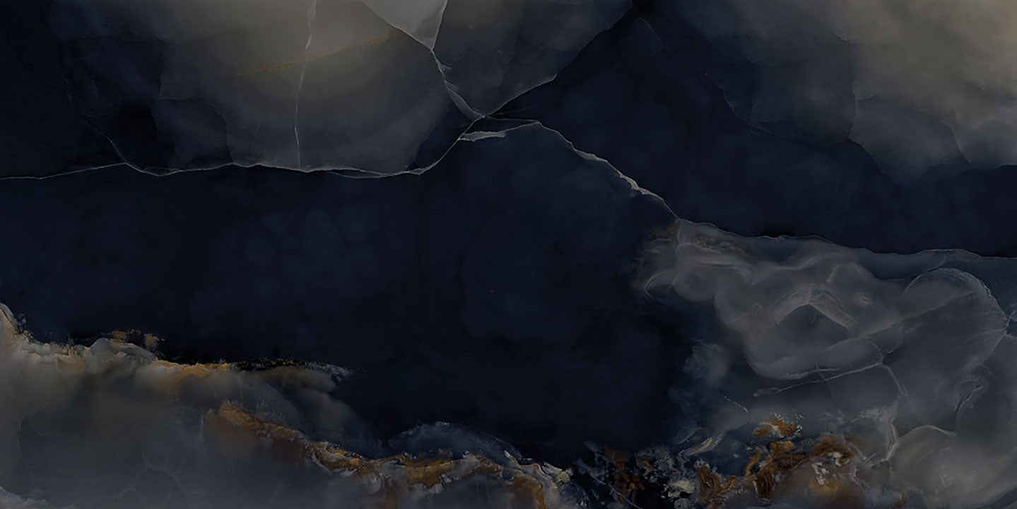 Onyx Misterioso surface with dramatic dark blue and gray veining patterns and translucent finish — premium countertop fabrication by Signature Stone Las Vegas