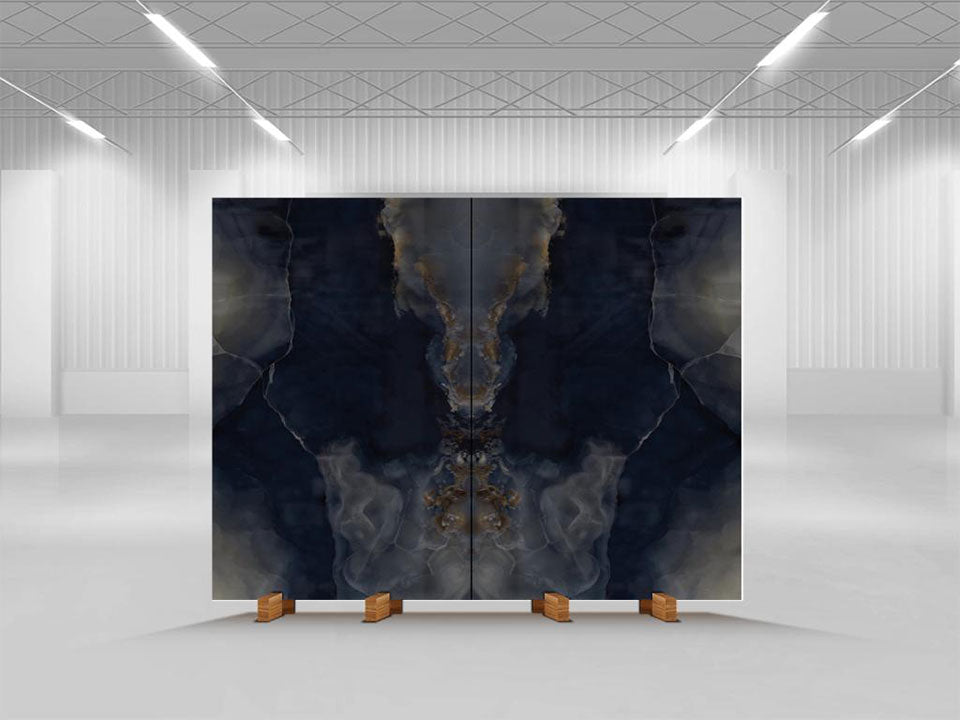 Onyx Misterioso slab with dramatic dark navy and gold veining in symmetrical book-matched pattern — custom countertops fabricated and installed by Signature ...