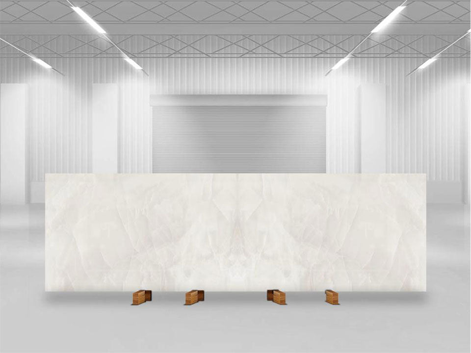 Onyx Nuvolato slab with white and gray veining displayed in modern showroom — custom countertops fabricated and installed by Signature Stone LV