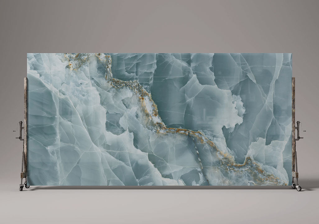 Onyx Oceano slab with blue-gray marble patterns and gold veining on display stand — premium countertop fabrication by Signature Stone Las Vegas