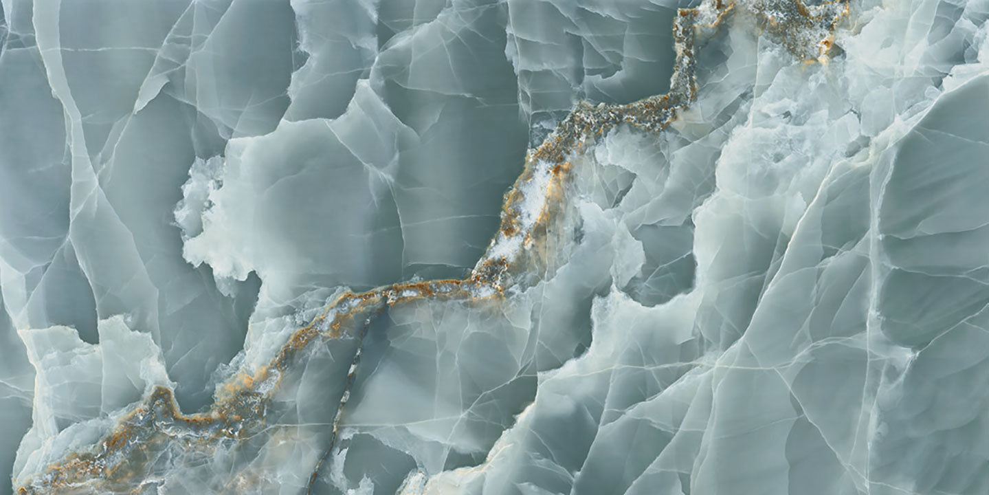 Onyx Oceano slab with blue-gray veining and golden mineral deposits — elegant stone countertops installed by Signature Stone Las Vegas