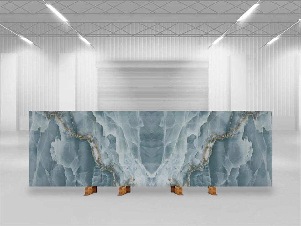 Onyx Oceano slab with blue-gray veining and gold accents displayed in showroom — custom countertops fabricated and installed by Signature Stone LV